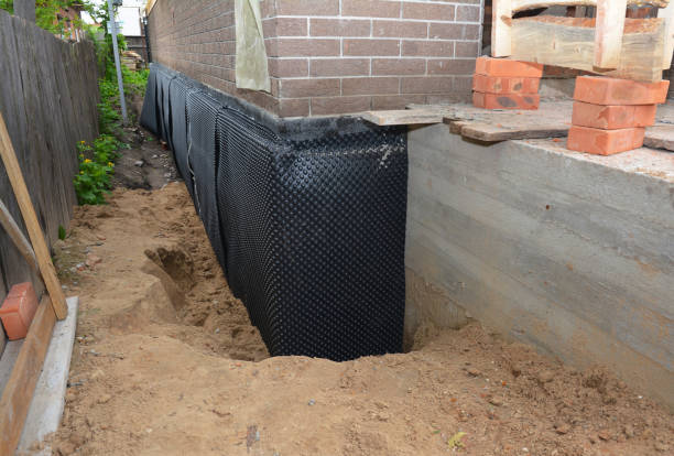 Happy homeowners after waterproofing job in Glenford
